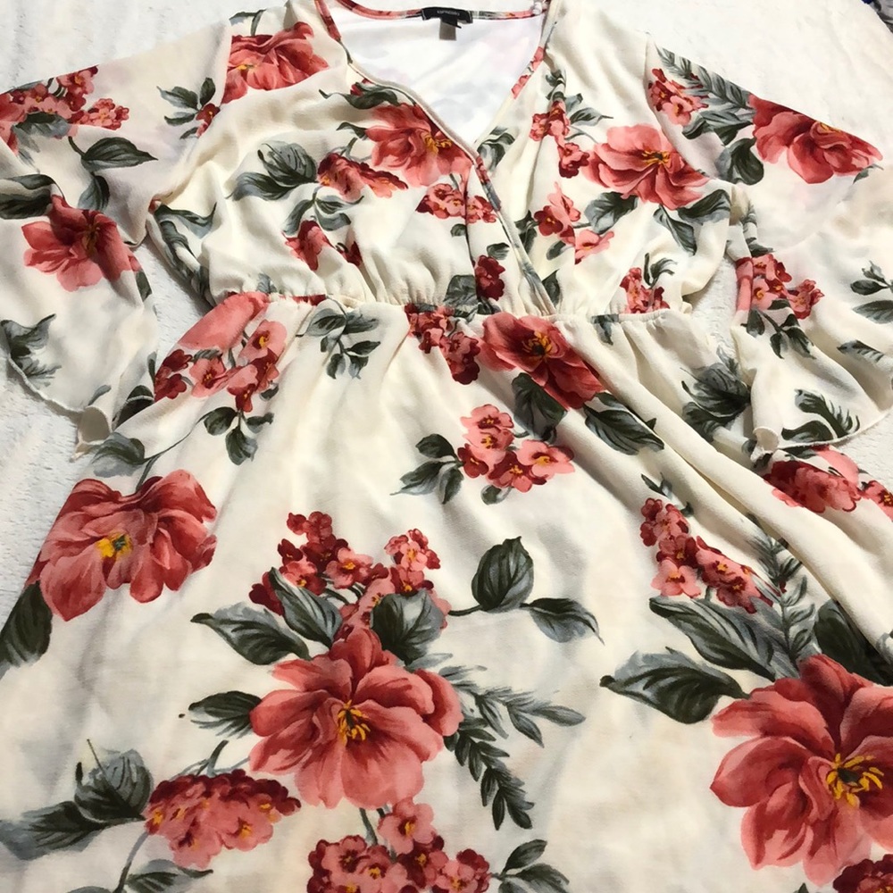 A beautiful white dress with pink flowers